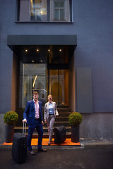 Image showing business people couple entering  hotel