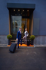 Image showing business people couple entering  hotel