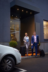 Image showing business people couple entering  hotel