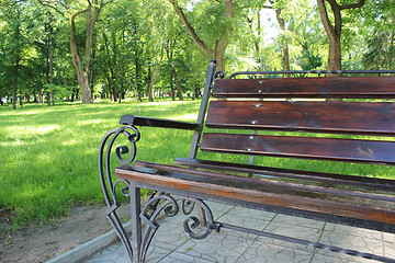 Image showing bench in the beautiful park with many green trees