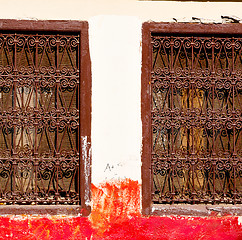 Image showing red   window in morocco africa old construction and brown wall  