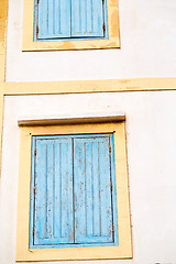 Image showing blue window in  and brown wall  construction