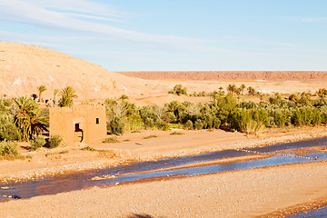 Image showing sunset in africa old   near the river blue