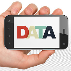 Image showing Data concept: Hand Holding Smartphone with Data on  display