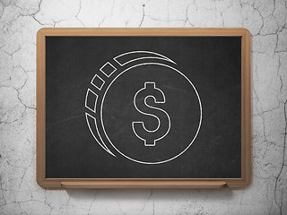 Image showing Money concept: Dollar Coin on chalkboard background