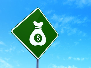 Image showing Business concept: Money Bag on road sign background