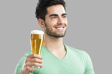 Image showing Young man drinking beer