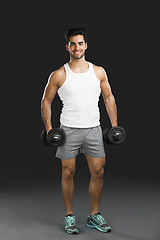 Image showing Athletic man lifting weights