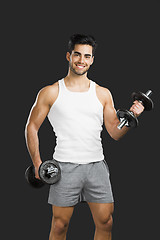 Image showing Athletic man lifting weights