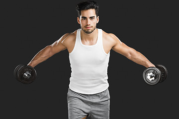 Image showing Athletic man lifting weights