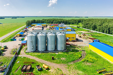 Image showing Corn dryer silos standing in machine yard