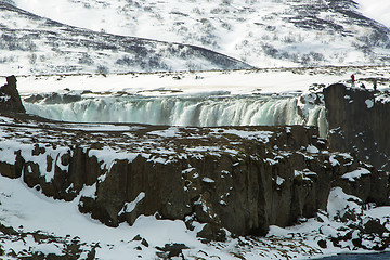 Image showing Tourists at the Icelandic waterfall Godafoss in wintertime