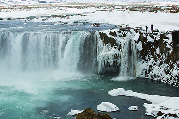 Image showing Tourists at the Icelandic waterfall Godafoss in wintertime