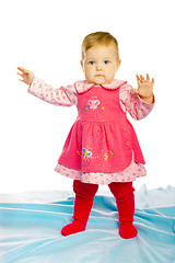 Image showing baby girl in a dress standing