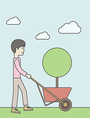 Image showing Man pushing cart.