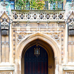 Image showing parliament in london old church door and marble antique  wall