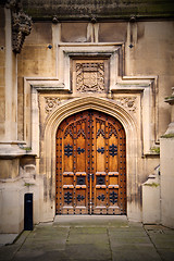 Image showing parliament in london old church door and marble antique  wall