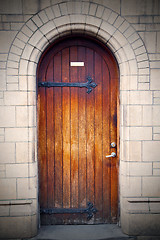 Image showing wooden parliament in london old church door and marble antique  