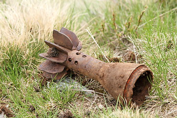 Image showing bomb shell case left in the field
