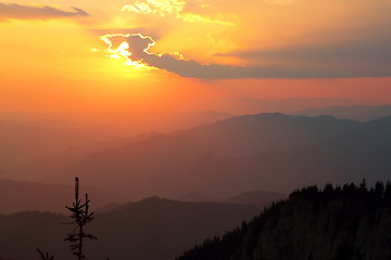 Image showing orange sunset over the mountains