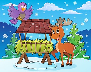 Image showing Hay rack with reindeer and bird