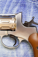 Image showing Nagan revolver on blue jeans background