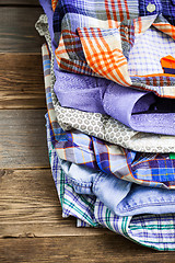 Image showing stack of bright colorful shirts