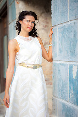 Image showing beautiful middle-aged woman in a white summer  dress