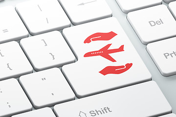 Image showing Insurance concept: Airplane And Palm on computer keyboard background