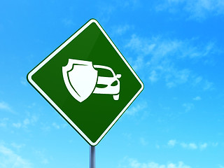 Image showing Insurance concept: Car And Shield on road sign background