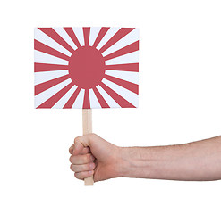 Image showing Hand holding small card - Flag of Japan