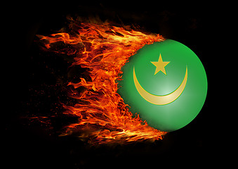 Image showing Flag with a trail of fire - Mauritania