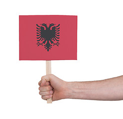 Image showing Hand holding small card - Flag of Albania