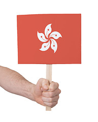 Image showing Hand holding small card - Flag of Hong Kong