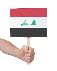 Image showing Hand holding small card - Flag of Iraq