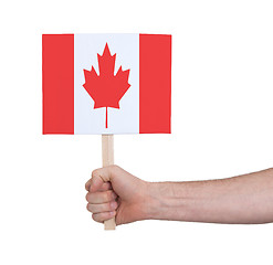 Image showing Hand holding small card - Flag of Canada