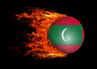 Image showing Flag with a trail of fire - Maldives