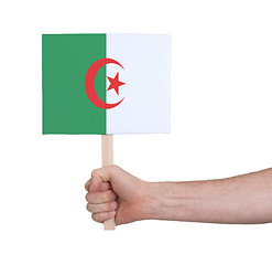 Image showing Hand holding small card - Flag of Algeria