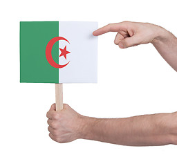 Image showing Hand holding small card - Flag of Algeria