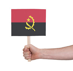 Image showing Hand holding small card - Flag of Angola