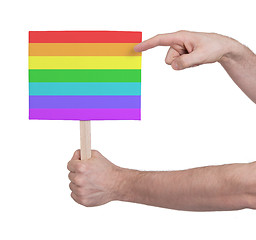 Image showing Hand holding small card - Flag of Rainbow flag