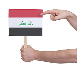 Image showing Hand holding small card - Flag of Iraq