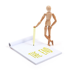 Image showing Wooden mannequin writing - The end