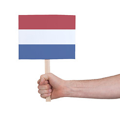 Image showing Hand holding small card - Flag of the Netherlands