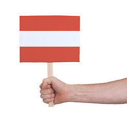 Image showing Hand holding small card - Flag of Austria