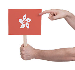 Image showing Hand holding small card - Flag of Hong Kong