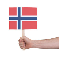 Image showing Hand holding small card - Flag of Norway