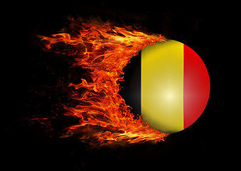 Image showing Flag with a trail of fire - Belgium