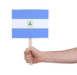 Image showing Hand holding small card - Flag of Nicaragua
