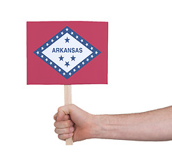 Image showing Hand holding small card - Flag of Arkansas